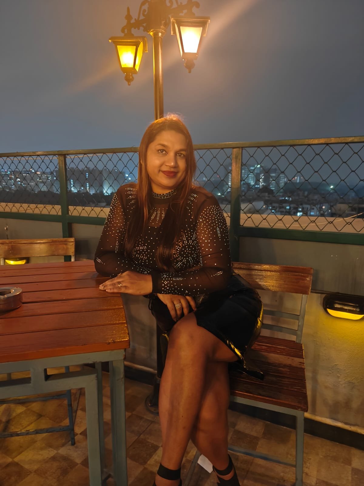 Neelam Roy enjoying a city lights evening at rooftop lounge